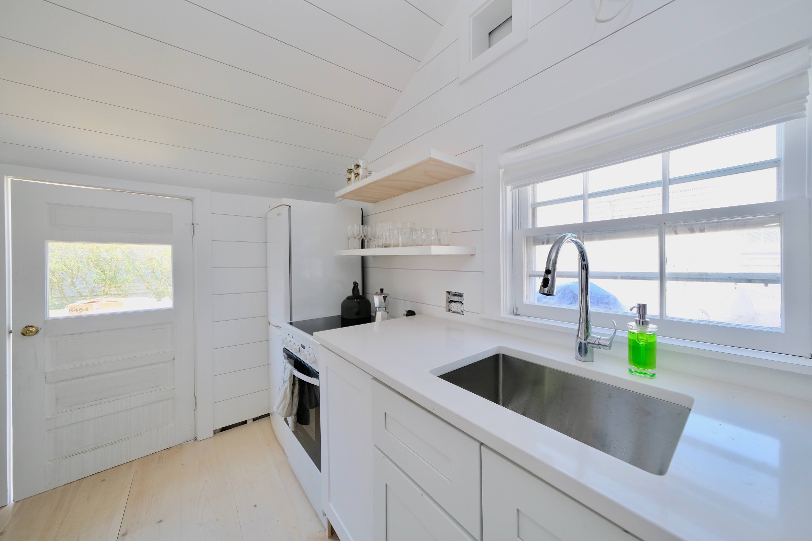 4 Cabot Lane Nantucket, MA 02554 - Photo 8 of 16 a kitchen that has a sink and a stove