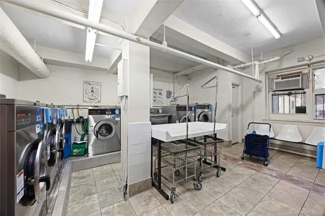 a view of a kitchen with a sink furniture and a window