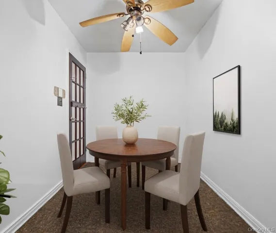 a living room with furniture potted plant and a window