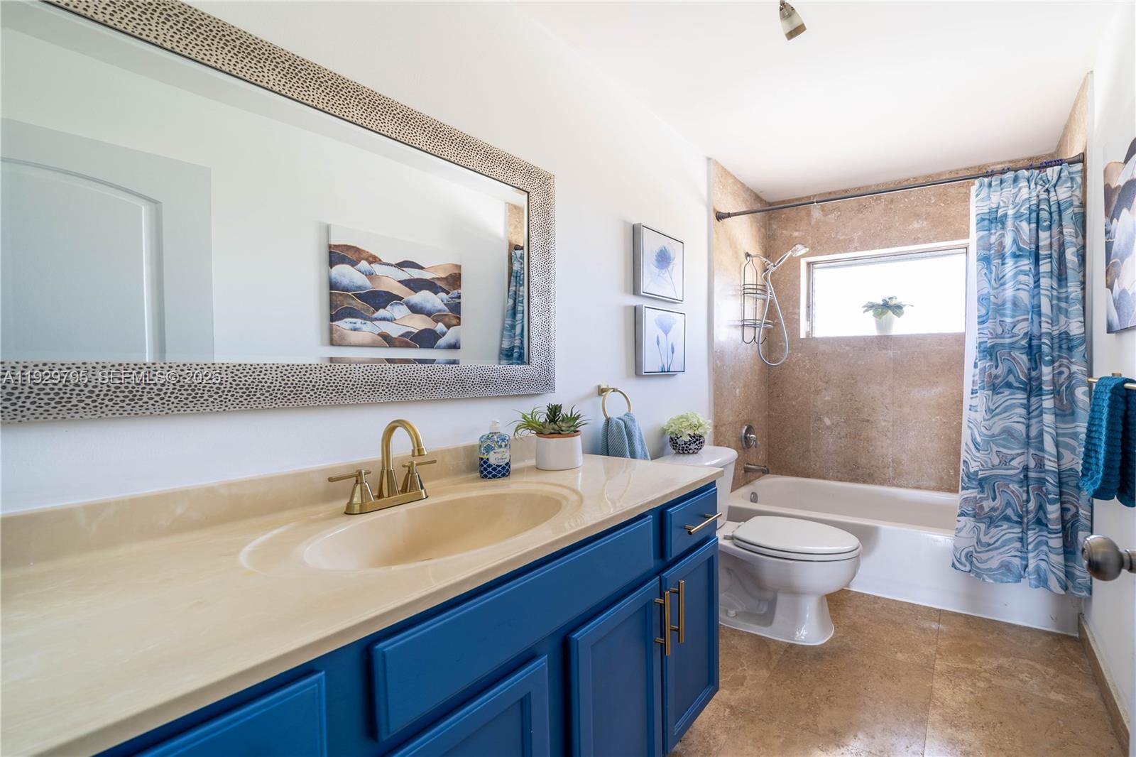 1855 Northeast 121st Street, Unit 32 North Miami, FL 33181 - Photo 12 of 22 a bathroom with a sink toilet a mirror and shower