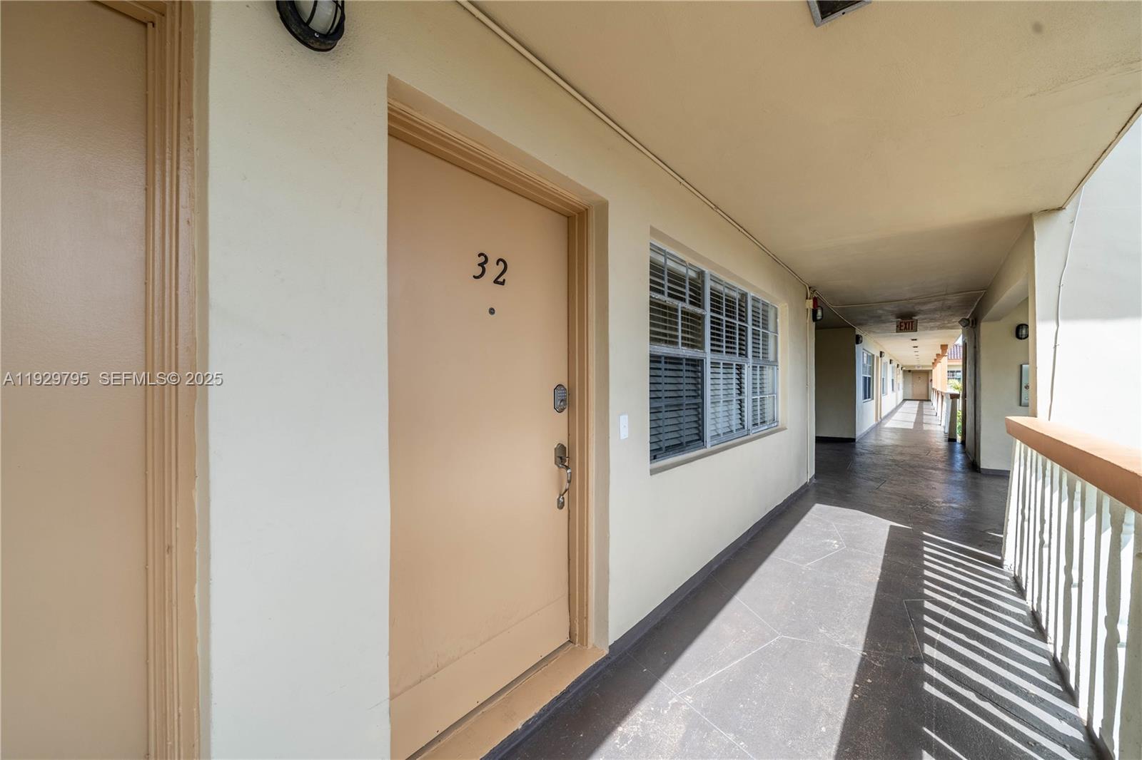 1855 Northeast 121st Street, Unit 32 North Miami, FL 33181 - Photo 19 of 22 a view of hallway with windows