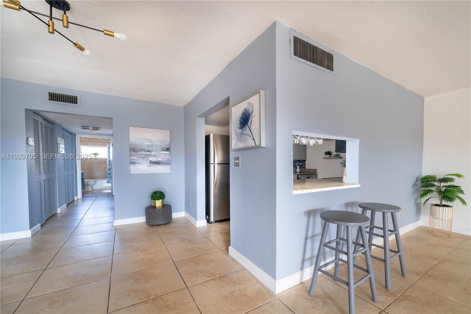 1855 Northeast 121st Street, Unit 32 North Miami, FL 33181 - Photo 10 of 22 a view interior of a house and natural light