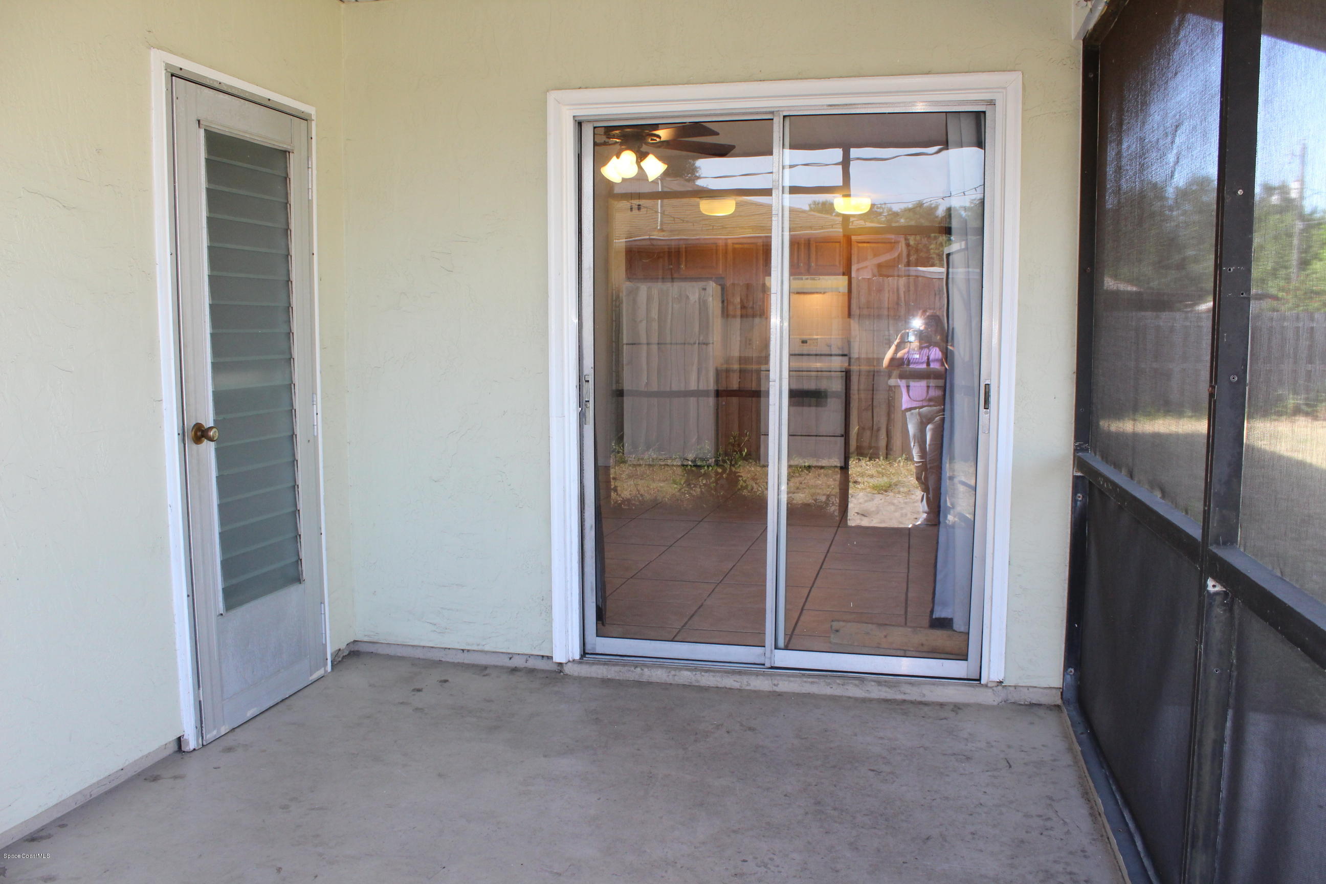 269 Capron Road Cocoa, FL 32927 - Photo 16 of 18 Screen Porch Back View