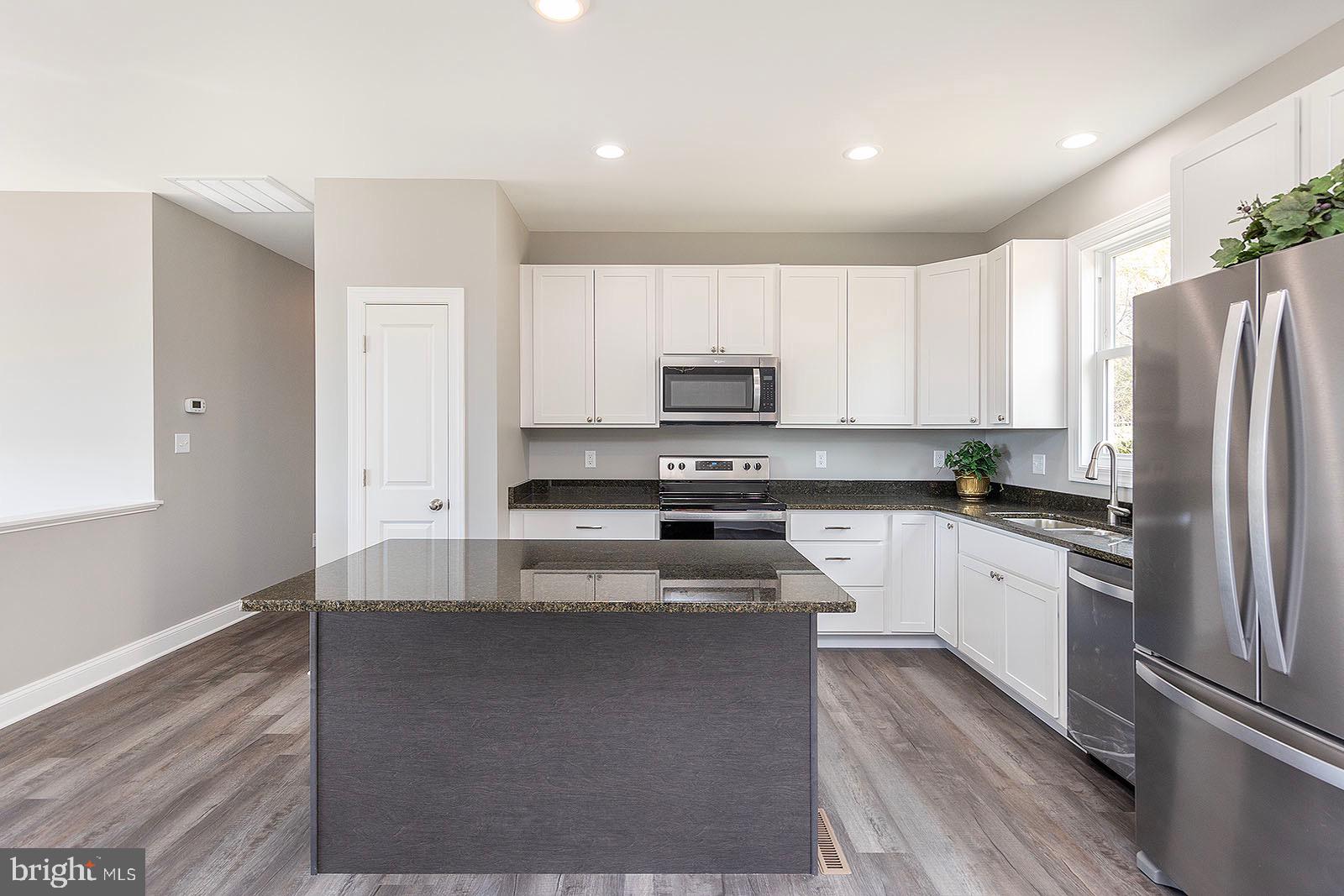 978 Round Hill Road Winchester, VA 22603 - Photo 8 of 41 Dark Grante top with white Kitchen Cabinets