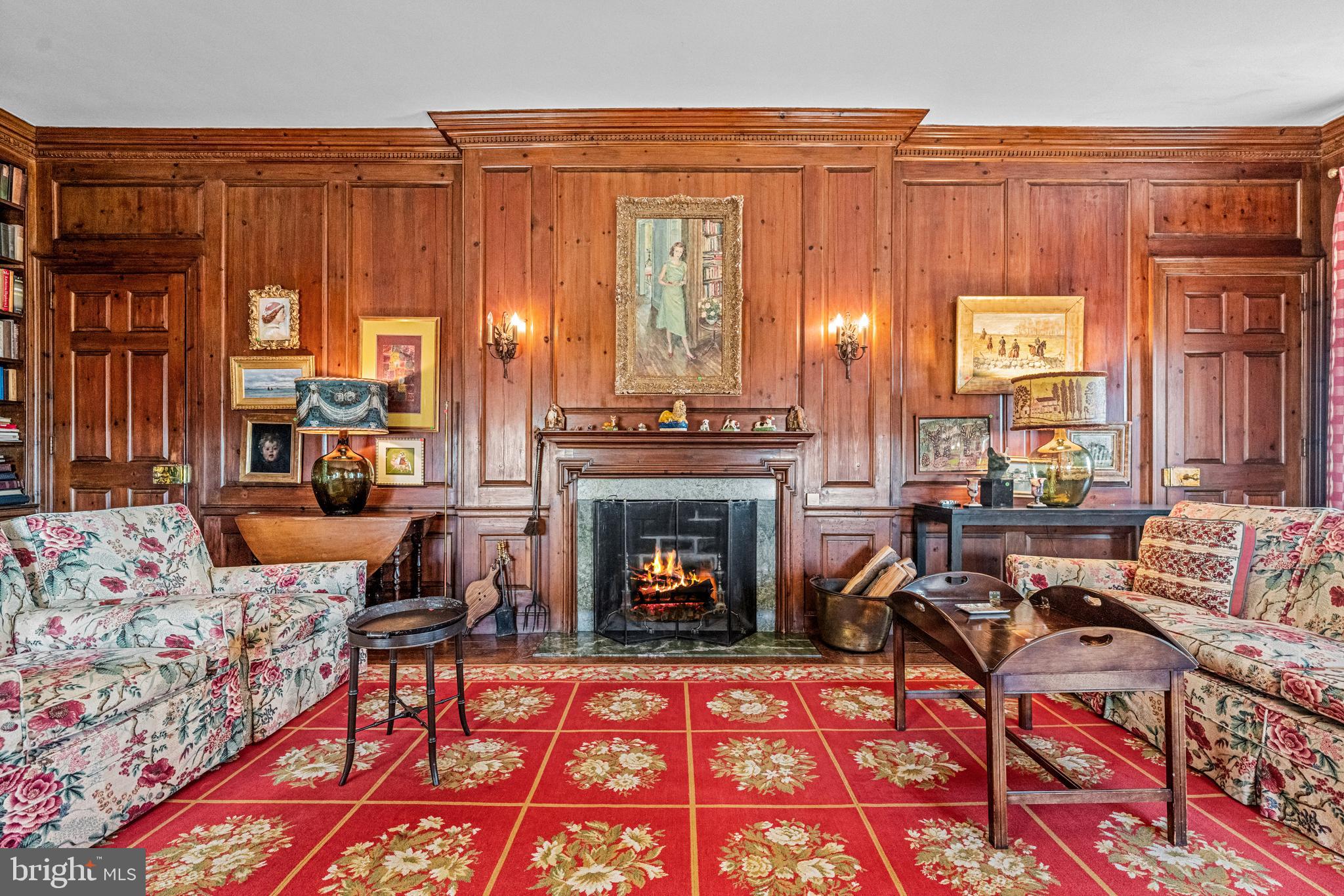705 Church Road Villanova, PA 19085 - Photo 14 of 54 a living room with furniture a rug a fireplace and a window