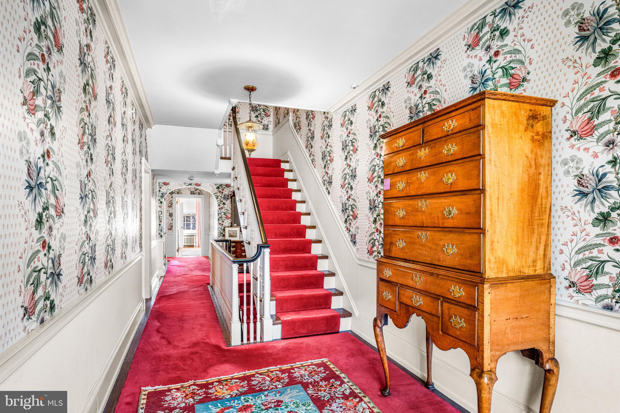 705 Church Road Villanova, PA 19085 - Photo 34 of 54 a view of a hallway with wooden floor and windows