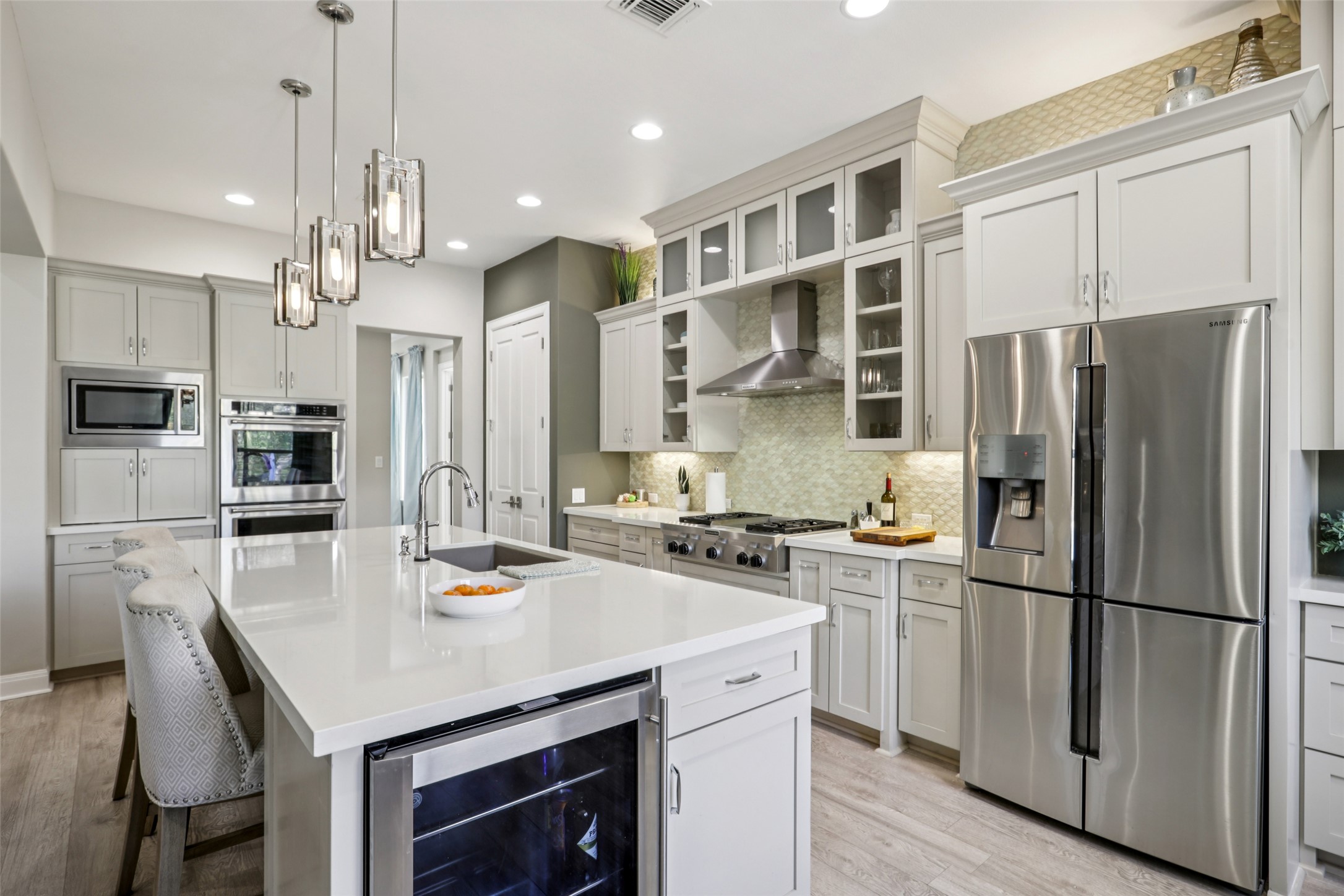 1000 Jonathan Cove Georgetown, TX 78628 - Photo 7 of 40 Expansive kitchen center island w/ wine fridge & breakfast bar seating