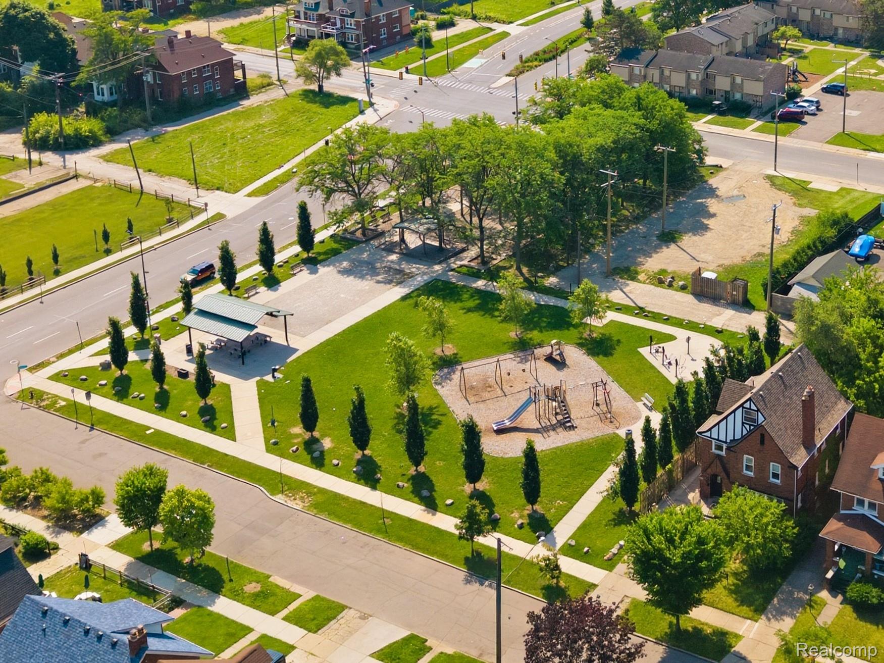 1945 Atkinson Street Detroit, MI 48206 - Photo 46 of 49 Aerial perspective showcasing a community park with mature trees, paved walking paths, and a shaded picnic area