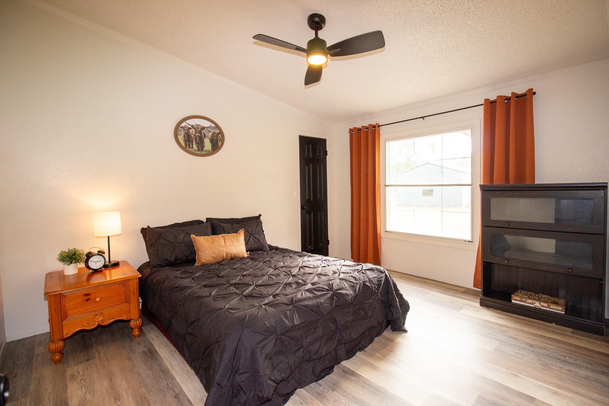 42857 Henson Road Hempstead, TX 77445 - Photo 12 of 18 a bedroom with a bed and a dresser