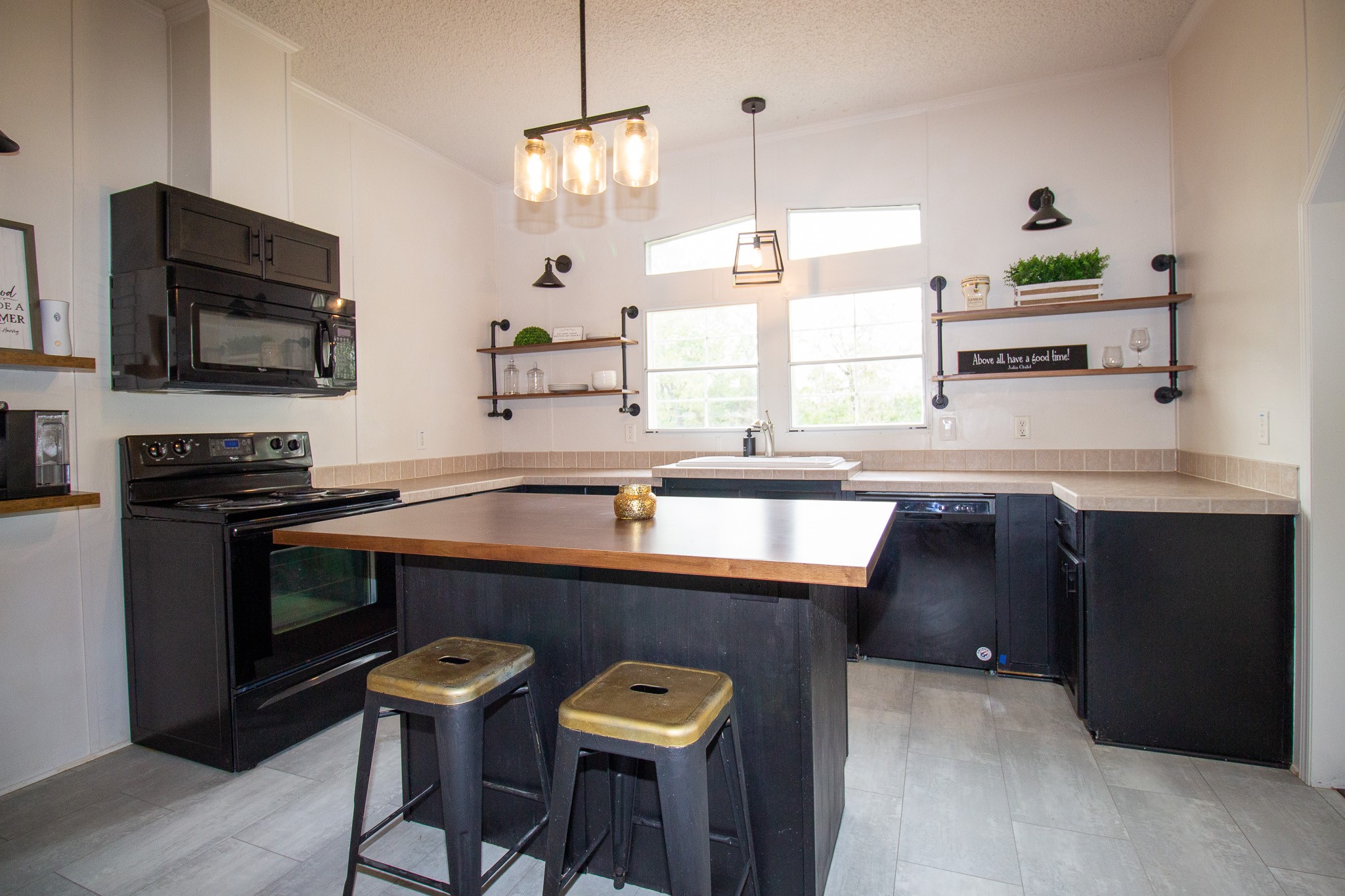 42857 Henson Road Hempstead, TX 77445 - Photo 7 of 20 a kitchen with stainless steel appliances a sink a stove and a refrigerator