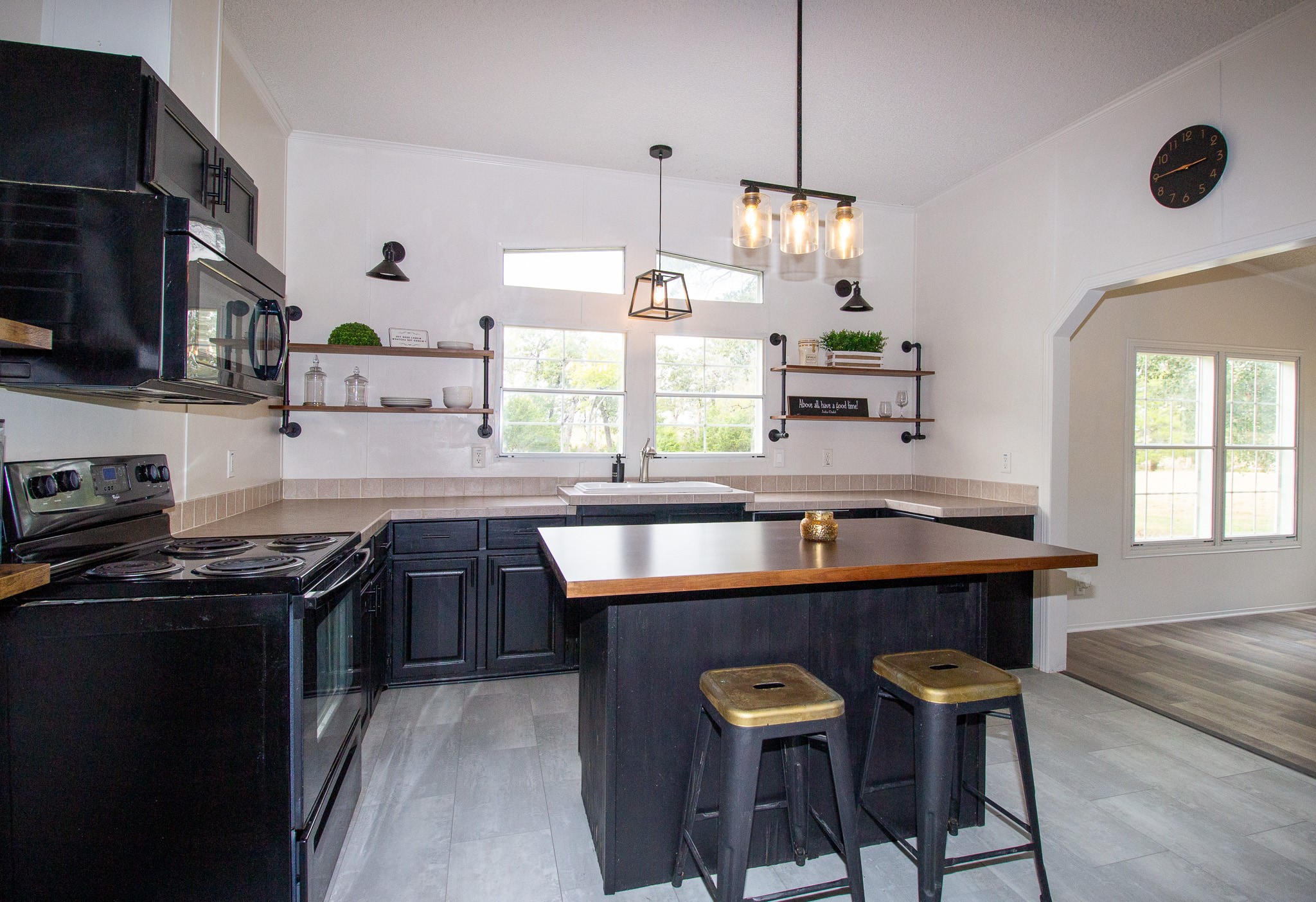 42857 Henson Road Hempstead, TX 77445 - Photo 7 of 18 a kitchen with stainless steel appliances granite countertop a sink a stove and a refrigerator
