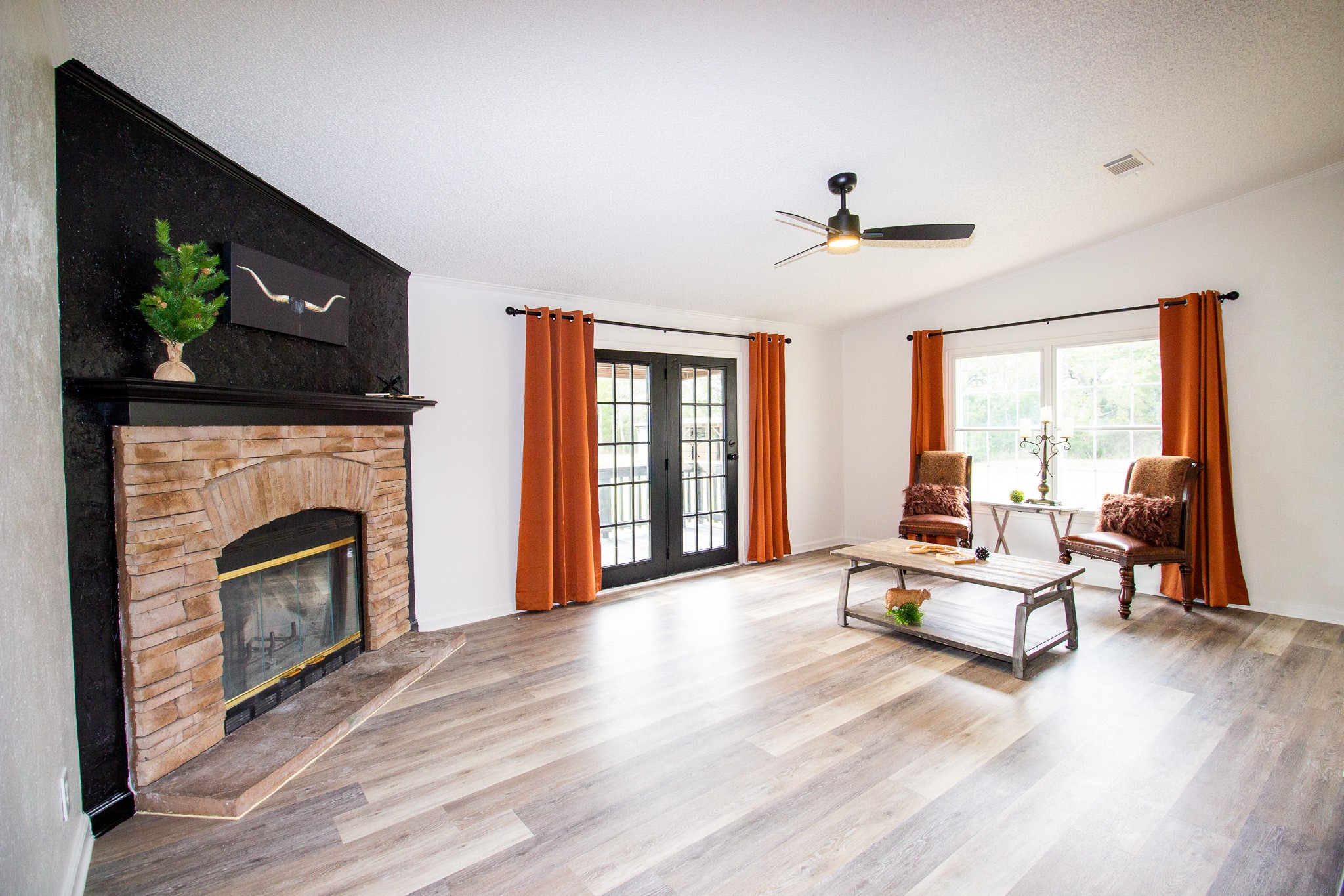 42857 Henson Road Hempstead, TX 77445 - Photo 10 of 20 a living room with furniture and a fireplace
