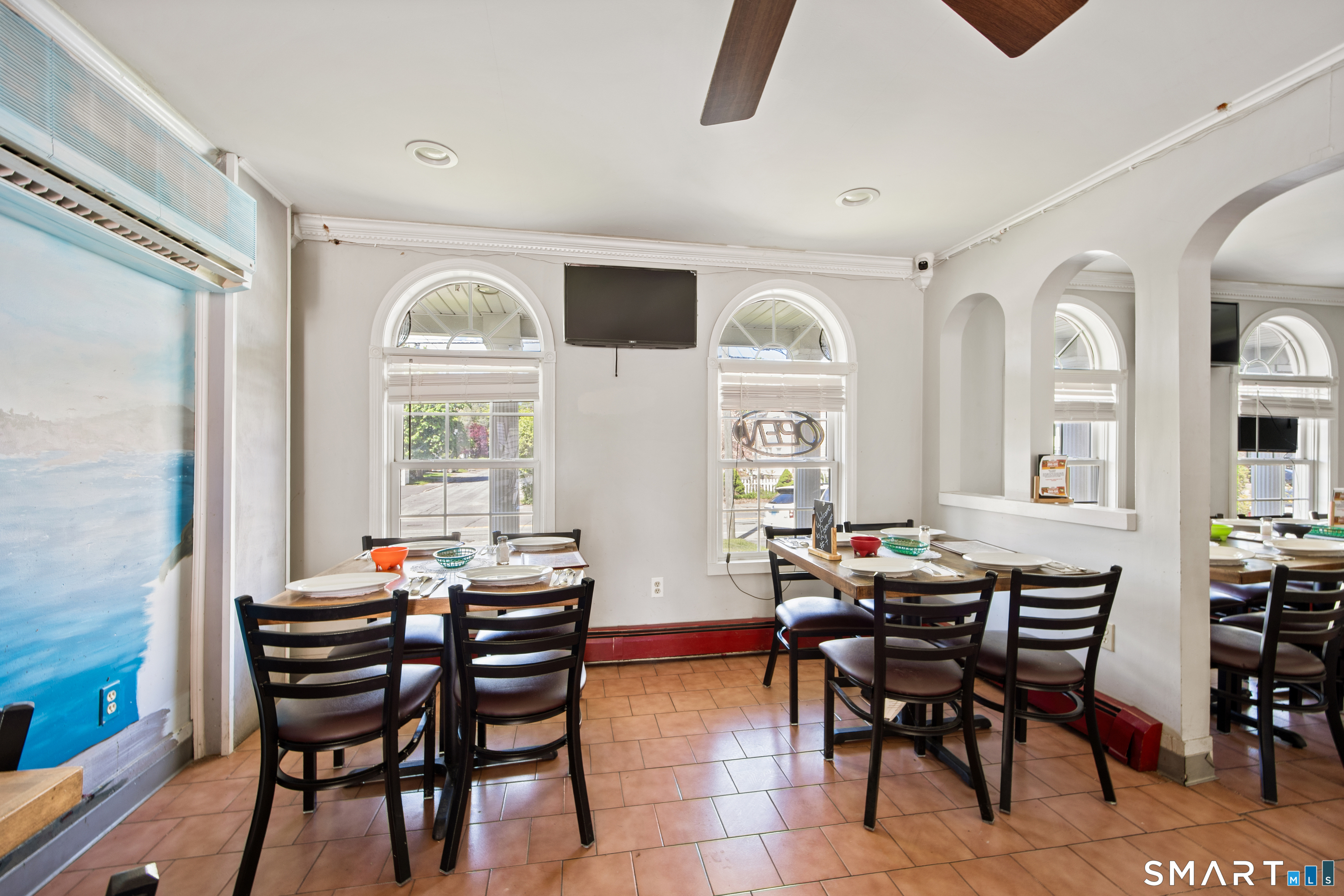 277 South Main Street Torrington, CT 06790 - Photo 3 of 26 a view of a dining room with furniture and a large window