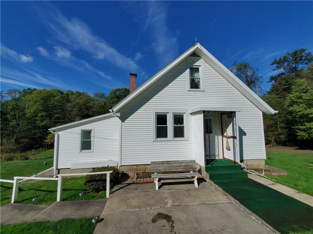 377 Fairview Road Fredonia, PA 16124 - Photo 1 of 27 a front view of a house with garden
