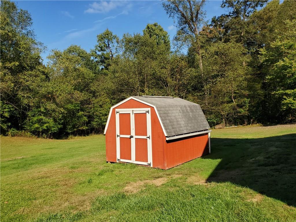 377 Fairview Road Fredonia, PA 16124 - Photo 5 of 27 a view of a backyard with swimming pool