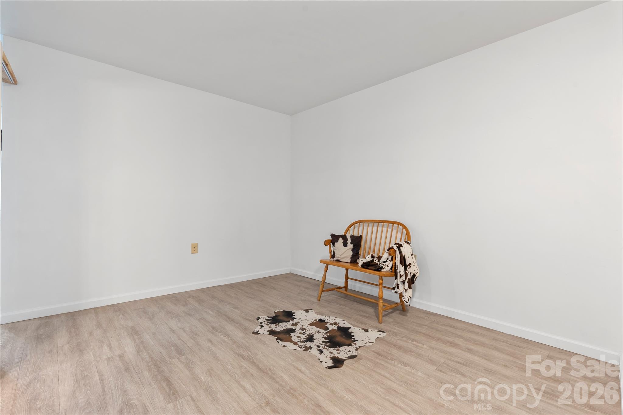 111 Pinewood Road Granite Falls, NC 28630 - Photo 23 of 33 a room with a wooden floor and gym equipment