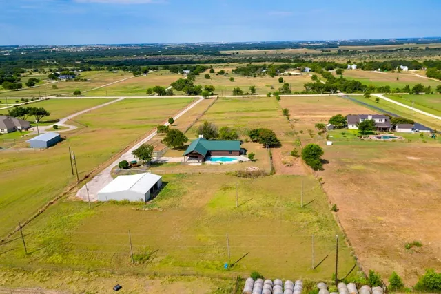a kitchen with granite countertop wooden cabinets and stainless steel appliances