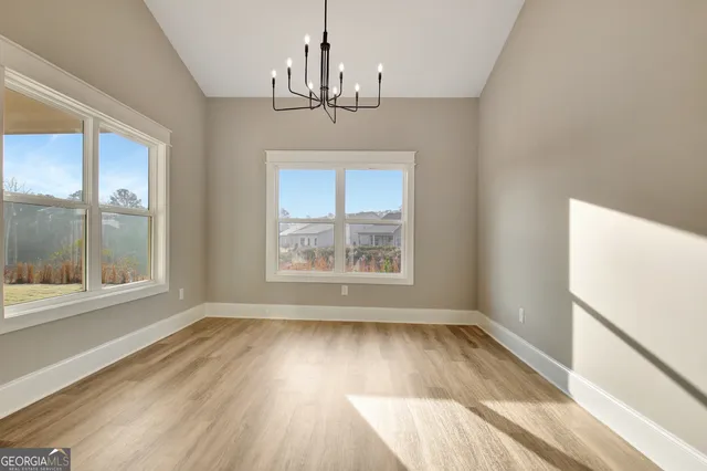 a view of a living room and a wooden floor