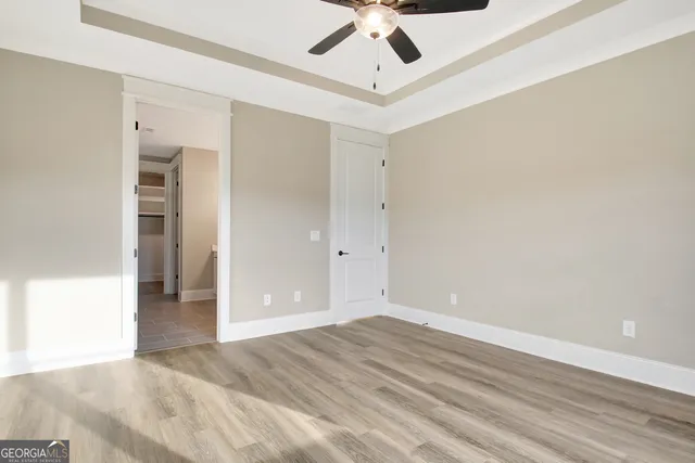 a bathroom with a double vanity sink a mirror and a bathtub