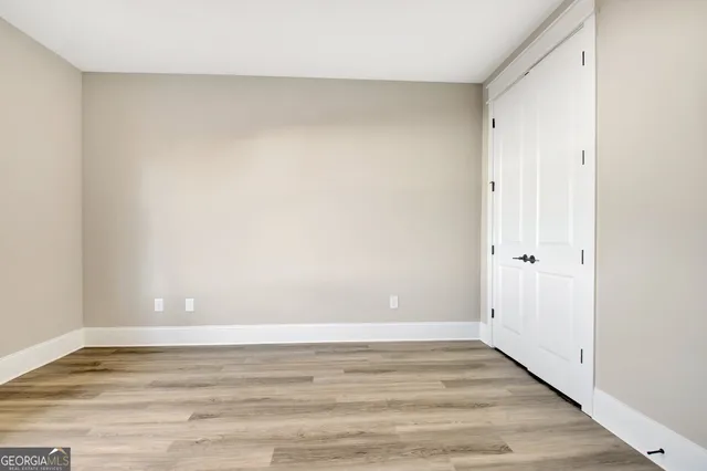 a bathroom with a sink toilet and a mirror