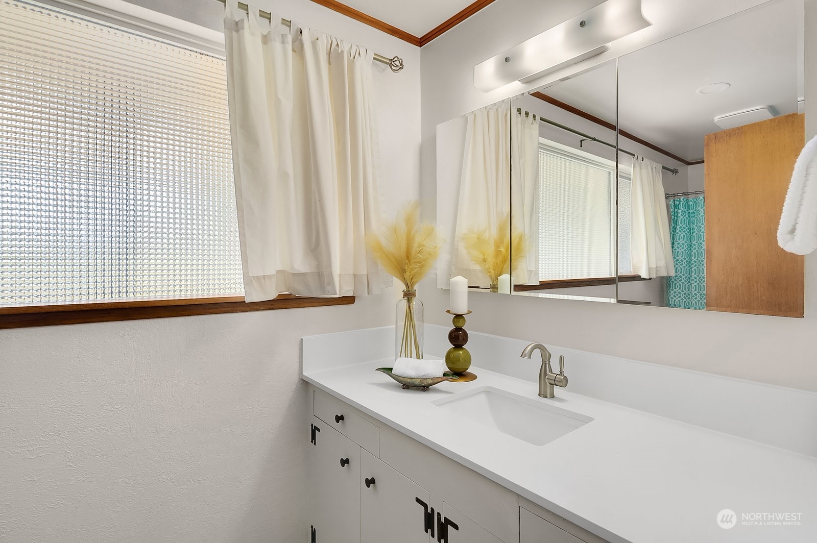 11004 Circle Drive Bothell, WA 98011 - Photo 12 of 14 a bathroom with a sink and a mirror