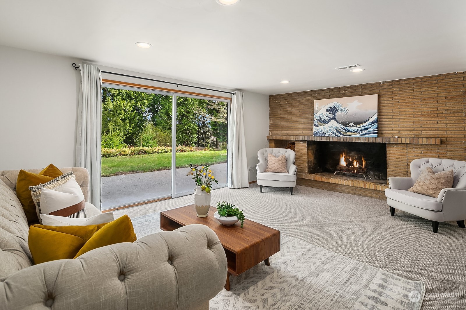 11004 Circle Drive Bothell, WA 98011 - Photo 13 of 14 a living room with furniture and a fireplace