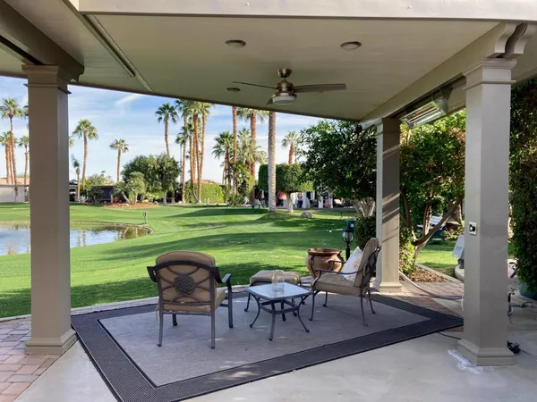 a view of a table and chairs in the patio