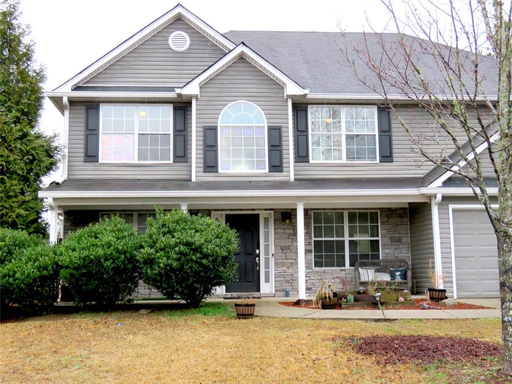a front view of a house with a patio