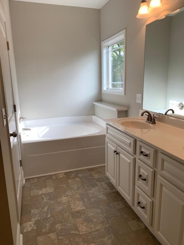 631 Ben Green Road Lebanon, TN 37090 - Photo 9 of 13 a spacious bathroom with a double vanity sink window and a bathtub