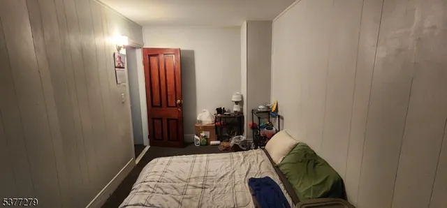 a bed room with a bed and a mirror