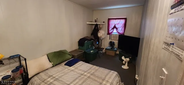 a bedroom with a bed and a closet