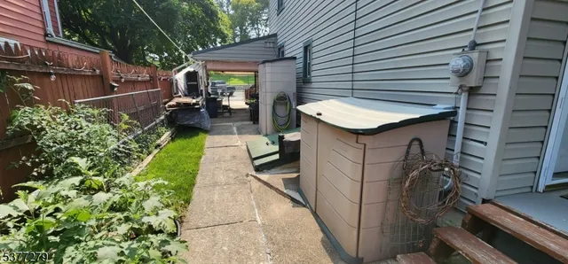 a backyard of a house with yard and furniture