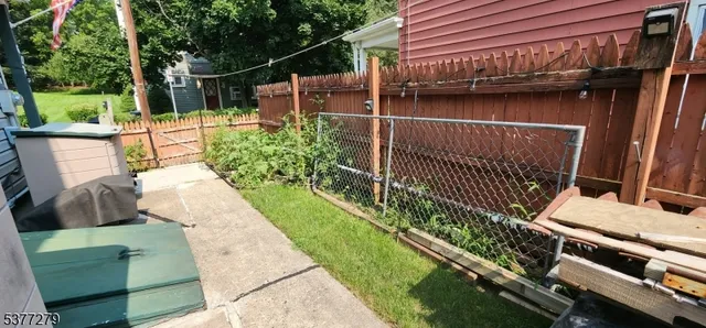 a view of balcony with two chairs and a table
