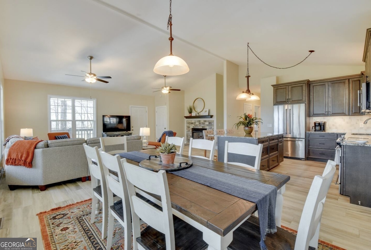 243 Degroff Lane Rabun Gap, GA 30568 - Photo 15 of 35 a view of a dining room with furniture and a flat screen tv