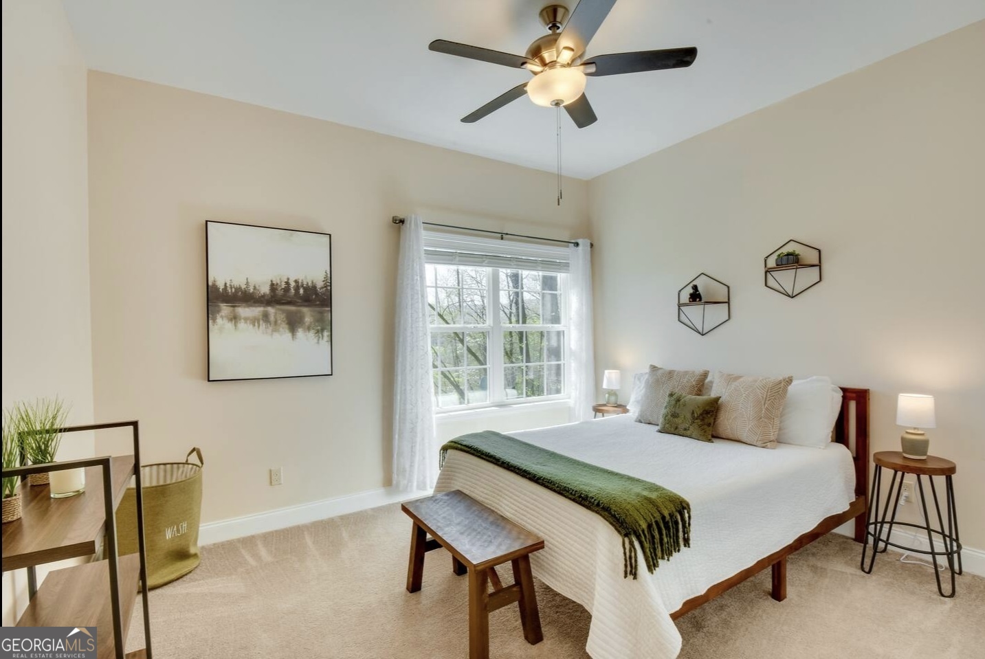 243 Degroff Lane Rabun Gap, GA 30568 - Photo 19 of 35 a bedroom with a bed and a chandelier