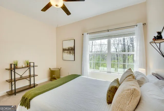 a bedroom with a bed and window