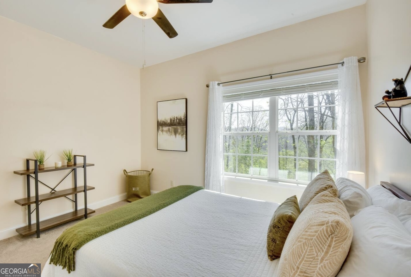 243 Degroff Lane Rabun Gap, GA 30568 - Photo 20 of 35 a bedroom with a bed and window