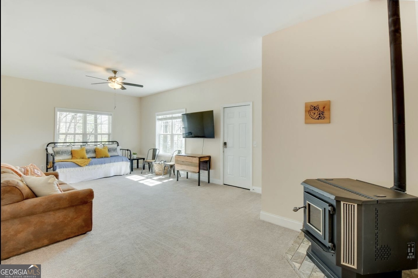 243 Degroff Lane Rabun Gap, GA 30568 - Photo 22 of 35 a living room with furniture and a flat screen tv