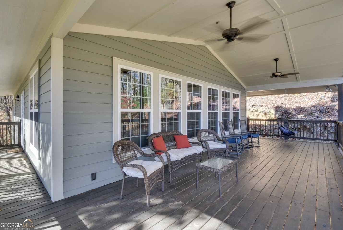 243 Degroff Lane Rabun Gap, GA 30568 - Photo 24 of 35 a living room with furniture and a wooden floor