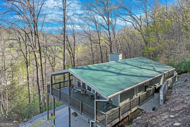 a view of a wooden deck front of house