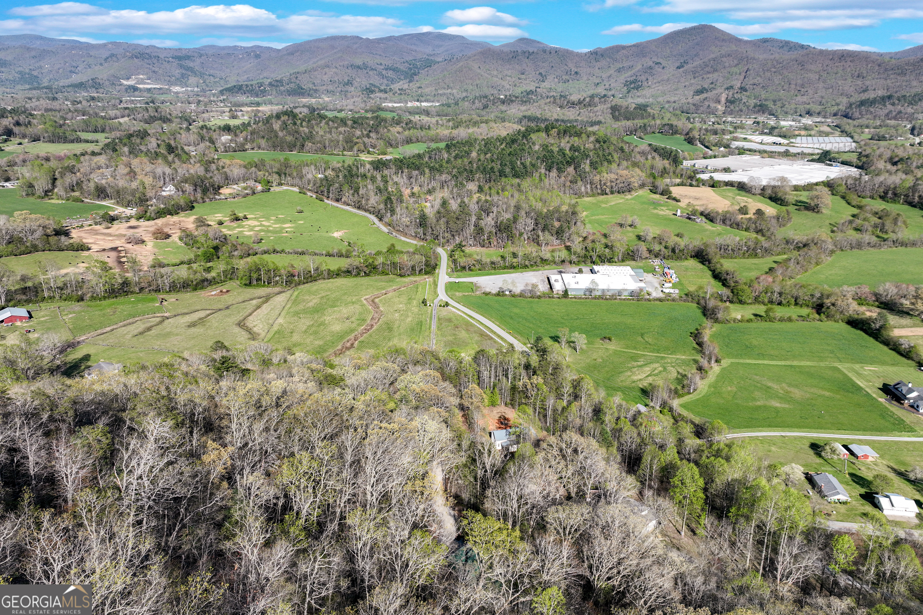 243 Degroff Lane Rabun Gap, GA 30568 - Photo 33 of 35 a view of a lush green hillside and houses