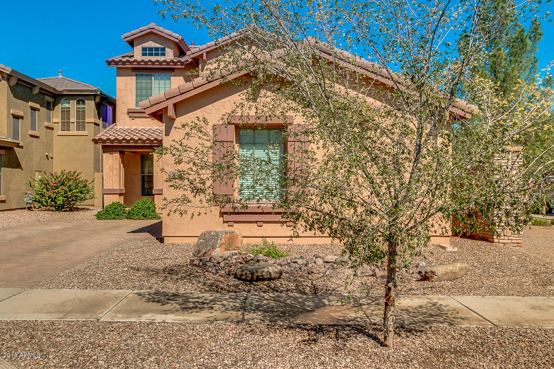 3954 East Morelos Street Gilbert, AZ 85295 - Photo 1 of 31 a front view of a house with a yard