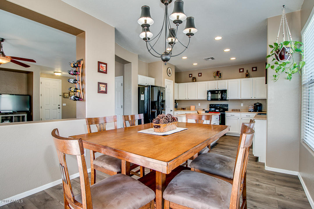3954 East Morelos Street Gilbert, AZ 85295 - Photo 13 of 31 a view of a dining room with furniture
