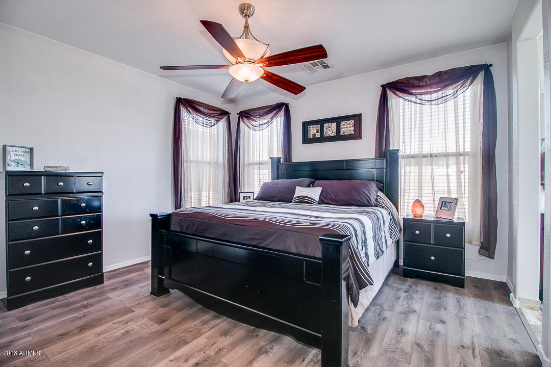 3954 East Morelos Street Gilbert, AZ 85295 - Photo 18 of 31 a bedroom with a bed closet and window