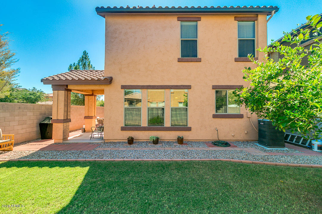 3954 East Morelos Street Gilbert, AZ 85295 - Photo 28 of 31 a front view of a house with a yard
