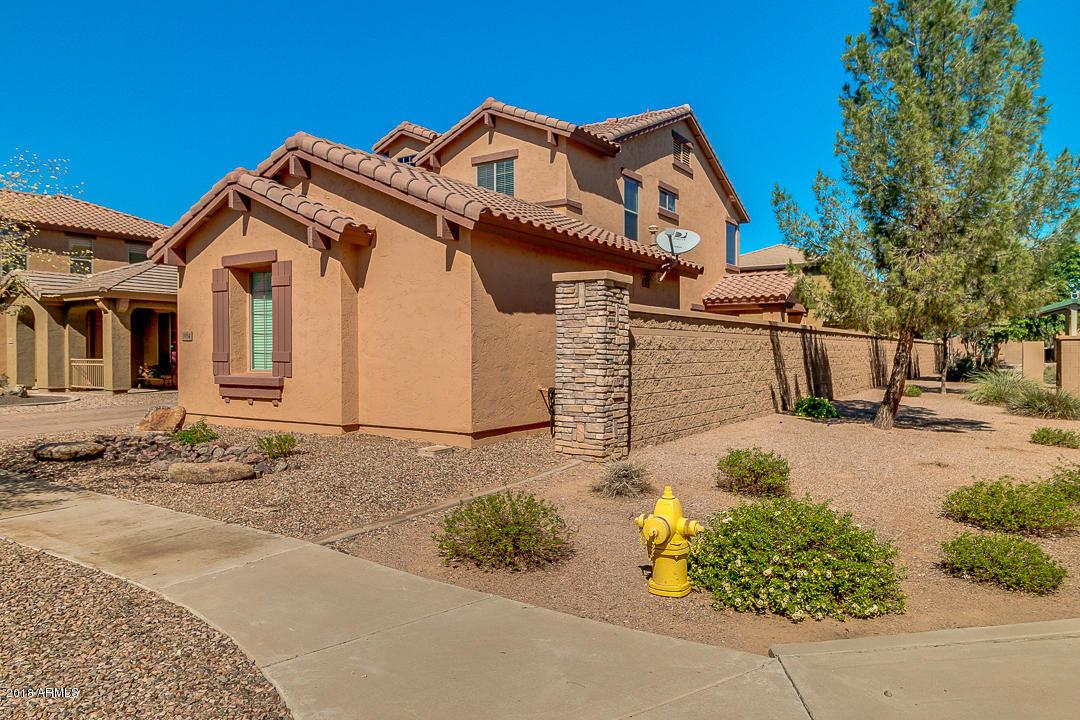 3954 East Morelos Street Gilbert, AZ 85295 - Photo 3 of 31 a front view of a house with a yard