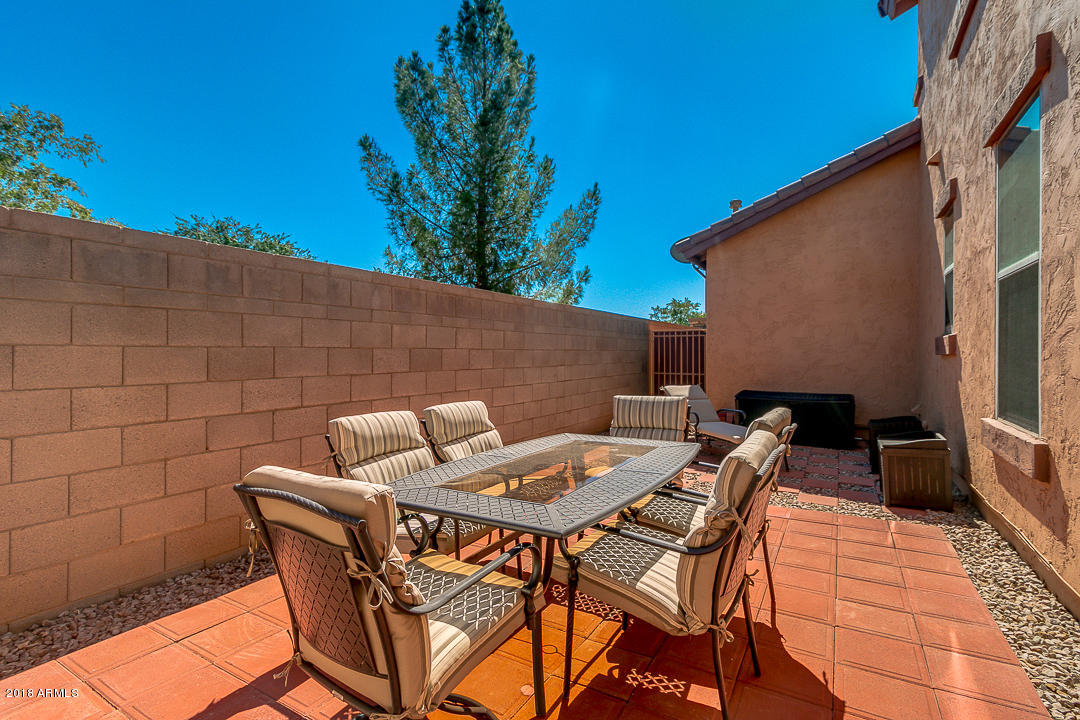 3954 East Morelos Street Gilbert, AZ 85295 - Photo 31 of 31 a view of patio with table and chairs and potted plants
