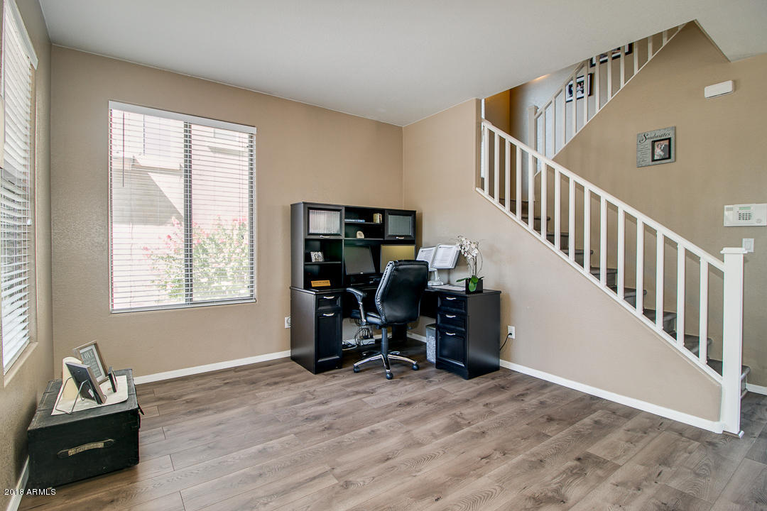 3954 East Morelos Street Gilbert, AZ 85295 - Photo 5 of 31 a view of a workspace with furniture and a window
