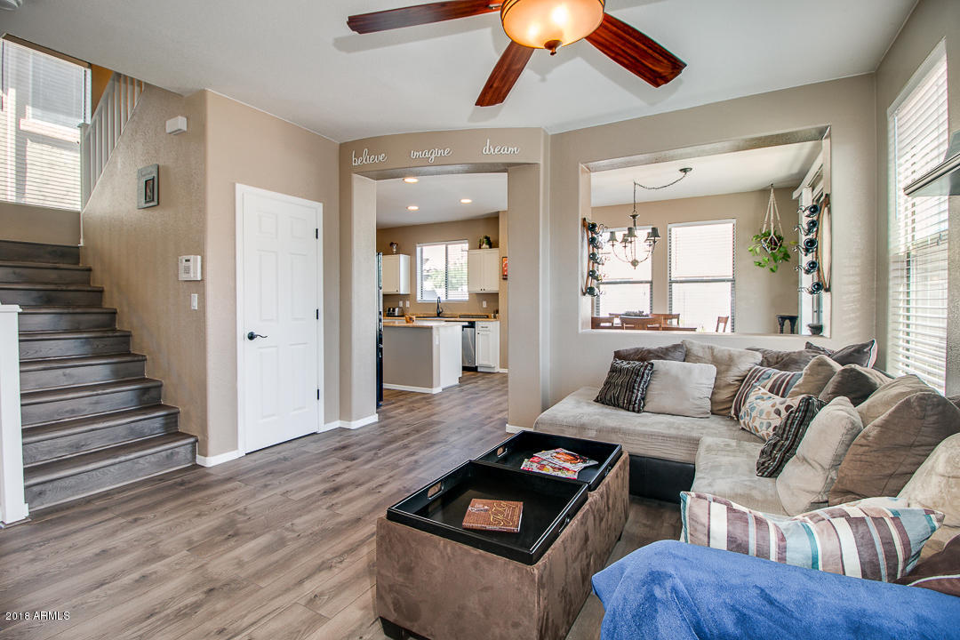 3954 East Morelos Street Gilbert, AZ 85295 - Photo 6 of 31 a living room with furniture and wooden floor