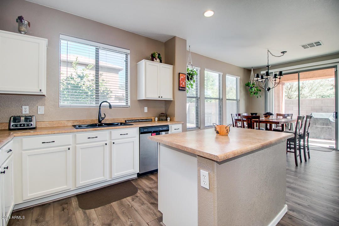 3954 East Morelos Street Gilbert, AZ 85295 - Photo 10 of 31 a kitchen with sink stove and cabinets